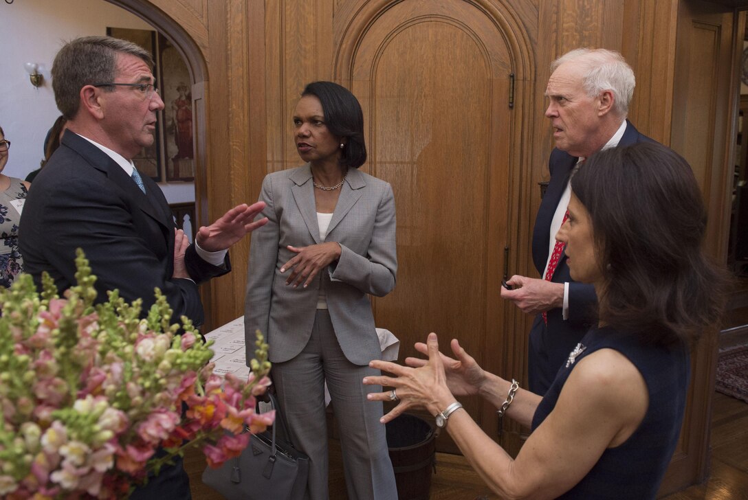 Defense Secretary Ash Carter, left, speaks former Secretary of State Condoleezza Rice and Stanford University President John Leroy Hennessy as he arrives at the Lou Henry Hoover House in Stanford, Calif., May 11, 2016, for a ceremony to honor former Secretary of State George P. Shultz. Carter presented Shultz. DoD photo by Air Force Senior Master Sgt. Adrian Cadiz