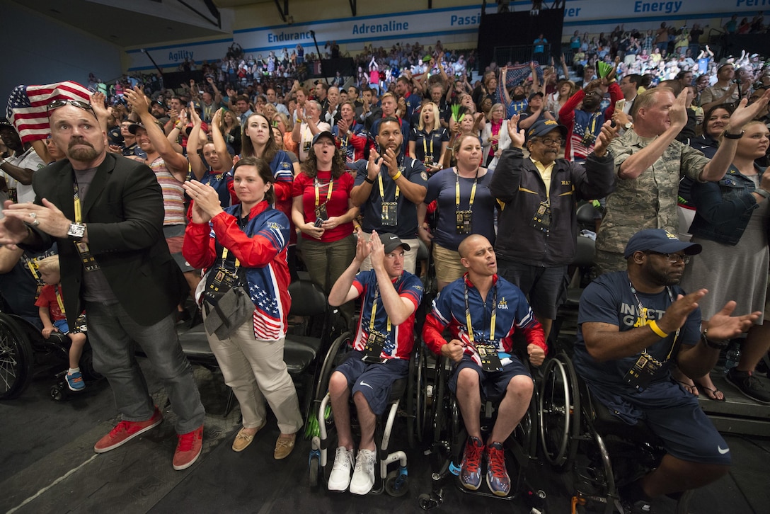 Members of the U.S. rugby team, veterans, service members and other supporters celebrate as the U.S. defeats Denmark in their finals wheelchair rugby match to win the gold medal during the 2016 Invictus Games in Orlando, Fla., May 11, 2016. DoD photo by Roger Wollenberg