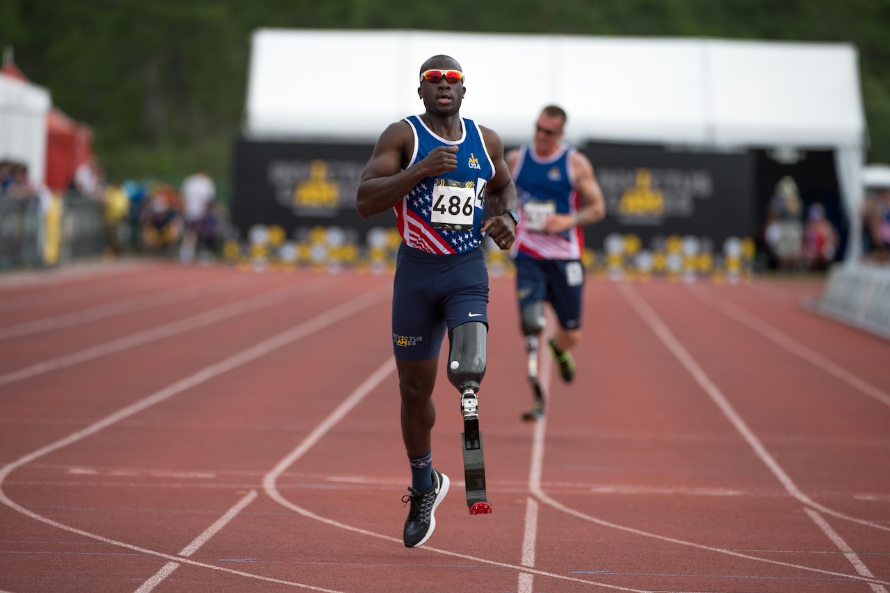 Army veteran and captain of the USA team, Will Reynolds, races to the finish line during the 2016 Invictus Games in Orlando, Fla., May 11, 2016. DoD photo by EJ Hersom
