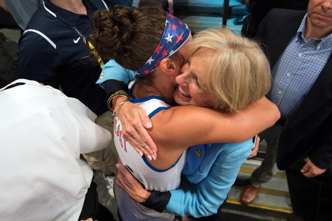 Dr. Jill Biden hugs Army Capt. Kelly Elmlinger after the U.S. team's victory over Denmark in the wheelchair rugby finals match at the 2016 Invictus Games in Orlando, Fla., May 11, 2016. DoD photo by Edward Joseph Hersom II