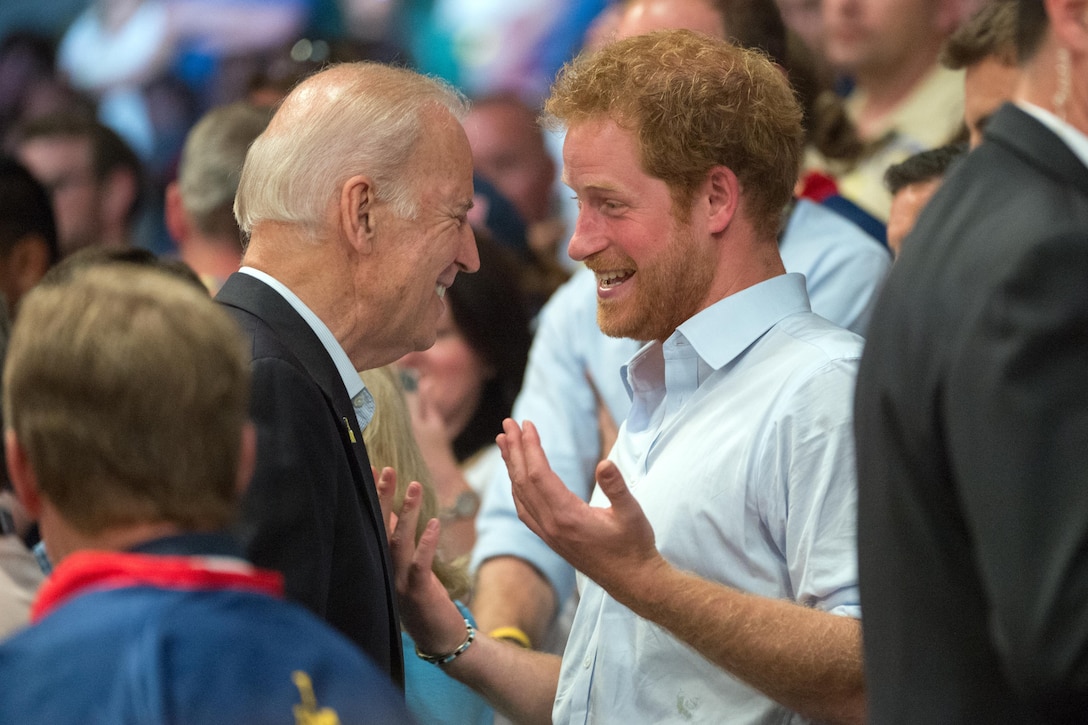 Vice President Joe Biden, left, and Prince Harry meet in the stands during the gold medal wheelchair rugby match at the 2016 Invictus Games in Orlando, Fla., May 11, 2016. DoD photo by Edward Joseph Hersom II