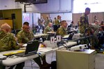 Department of Defense personnel react to a simulated nuclear detonation in Pittsburgh during Vibrant Response 2016 at Camp Atterbury, Ind., May 10, 2016. The annual exercise prepares military and civilian emergency response personnel to react to a national emergency. 