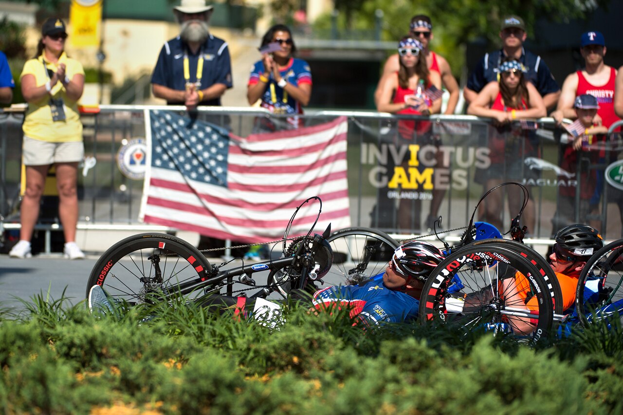 Retired Marine Corps Staff Sgt. Ronnie Jimenez, front, races a recumbent bike during the 2016 Invictus Games in Orlando, Fla., May 9, 2016. DoD photo by EJ Hersom