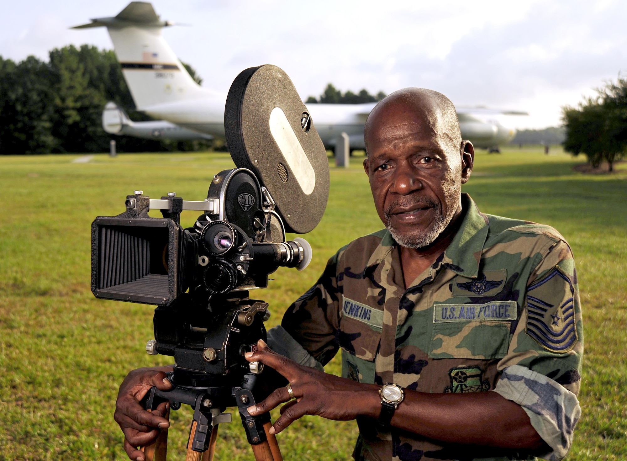 U.S. Air Force Ret. SMSgt (Ret) Mitchell Jenkins, Resource Management Officer, 1st Combat Camera Squadron served as a combat videographer from 10 Oct 68 to 1 Aug 89.  During his military career served two tours of duty in Southeast Asia as an aerial and ground combat documentation cameraman.  He flew over 100 combat missions in some 10 different air frames.  As an E-4, he was awarded the Distinguish Flying Gross, (4) Air Medals, and the Outstanding Unit Citation with “V” device.  Sgt Jenkins’ primary duty was Battle Damage Assessment (BDA) photographer with the 16th Special Operations Squadron onboard a C-130 Gunship, (SPECTRE).  His secondary duties included alert photographer for air rescue missions onboard H-53 (Jolly Green Giant) helicopters.  He also flew countless Forward Air Control (FAC) missions on OV-10 aircrafts, and air strike mission on F-100 Sabers, and F-4 Phantom fighters.  In addition, he flew many C-130 re-supply missions, and Army UH-1 medical evacuation missions throughout Vietnam.  He even voluntarily flew a few Air America missions to capture the actions of US forces in Southeast Asia.  Mr. Jenkins also flew over flew over 5,000 hours in various aircraft and he participated in many operational and humanitarian missions, one major event he documented in was in 1983, Operation UGENT FURY where film was the last time used during a mission. (U.S. Air Force Photo/ Staff Sgt. Angelita M. Lawrence)(released)
