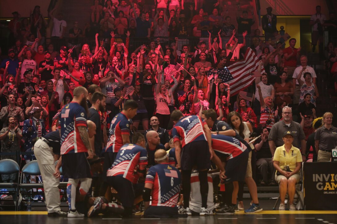 Fans cheer for U.S. sitting volleyball team members during the finals match against Great Britain at the 2016 Invictus Games in Orlando, Fla., May 11, 2016. The U.S. team beat Great Britain for the gold medal. Army photo by Sgt. Jason Edwards