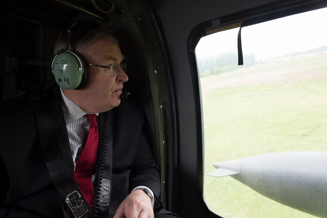 Deputy Defense Secretary Bob Work looks out the window of an H-60 Blackhawk helicopter as he departs the Aegis Ashore Inauguration Ceremony in Deveselu, Romania, May 12, 2016. DoD photo by Navy Petty Officer 1st Class Tim D. Godbee