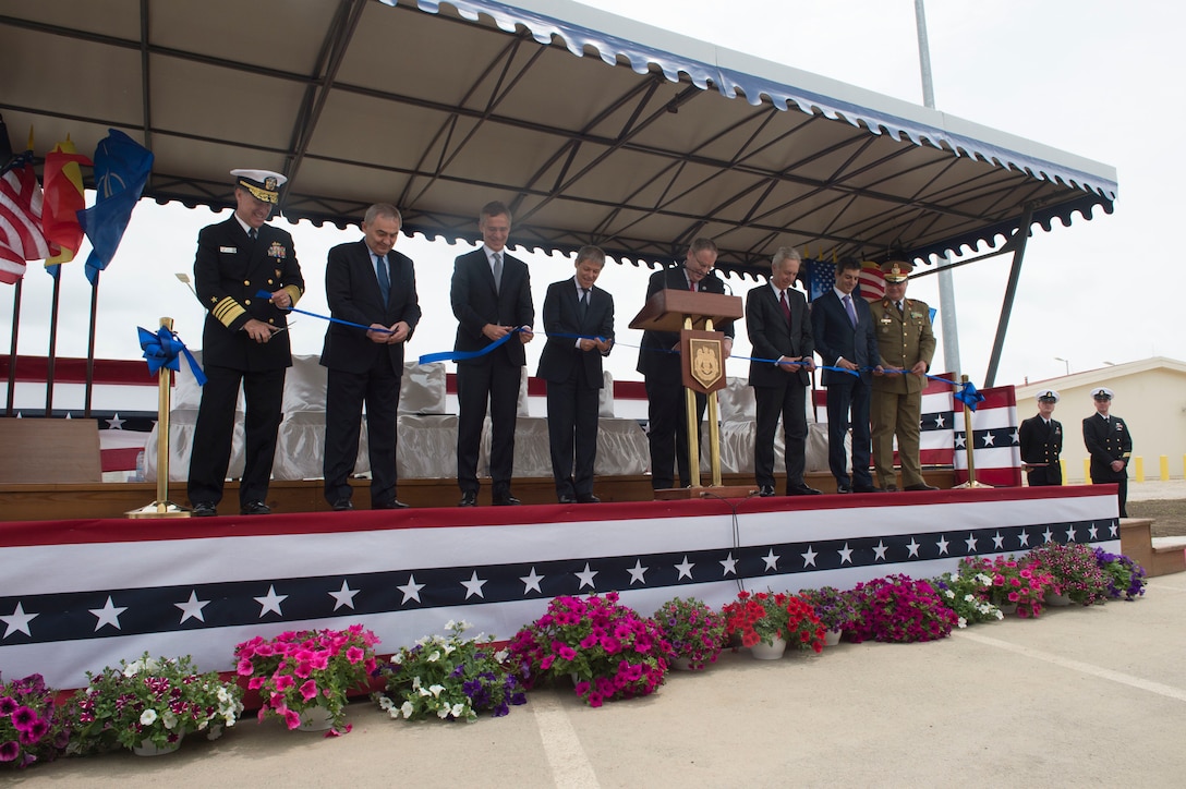 Deputy Defense Secretary Bob Work, fourth from right, Romanian Prime Minister Dacian Julien Ciolos, fourth from left, and the official party at the Aegis Ashore Inauguration Ceremony cut a ribbon to officially open the defense system in Deveselu, Romania, May 12, 2016. DoD photo by Navy Petty Officer 1st Class Tim D. Godbee