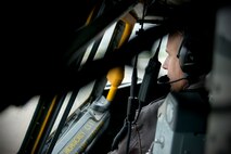 Lieutenant Col. Lanson Ross, 459th Operations Group pilot and chief of operations, looks out of the cockpit window of a KC-135R Stratotanker on the Joint Base Andrews flight line May 5. Members of the 459 OG and 459th Maintenance group helped taxi the aircraft to the DC Air National Guard hangar to serve as a static display for the USO's 75th birthday celebration. (U.S. Air Force photo by Staff Sgt. Kat Justen)