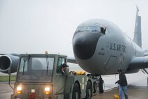 Members of the 459th Operations and Maintenance Groups taxi a KC-135R Stratotanker to the DC Air National Guard hangar on the Joint Base Andrews flight line May 5. Members of the 459 OG and 459 MXG setup the aircraft to serve as a static display for the USO's 75th birthday celebration. (U.S. Air Force photo by Staff Sgt. Kat Justen)