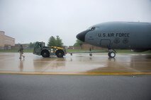 Members of the 459th Operations and Maintenance Groups taxi a KC-135R Stratotanker to the DC Air National Guard hangar on the Joint Base Andrews flight line May 5. Members of the 459 OG and 459 MXG setup the aircraft to serve as a static display for the USO's 75th birthday celebration. (U.S. Air Force photo by Staff Sgt. Kat Justen)
