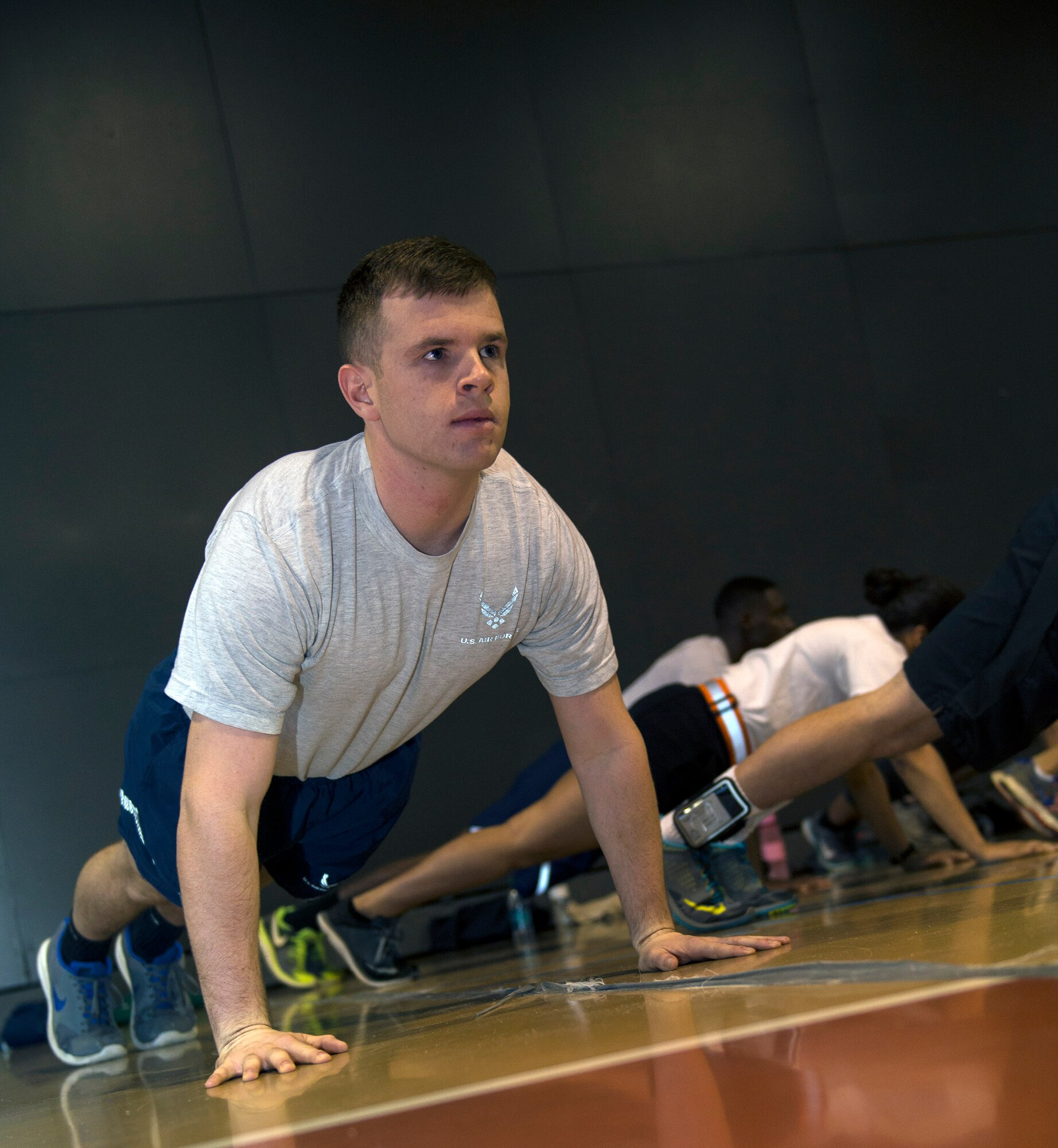 Cadet Col. Bradley Joyal, Air Force ROTC Detachment 172 cadet wing commander, performs a push-up during physical training with fellow cadets at a local college, Nov.16, 2015, in Valdosta, Ga. Joyal, a Georgia native, turned down several baseball scholarships to stay near home and entered Valdosta State University’s AFROTC program in hopes to serve his country like his father, a retired Chief Master Sergeant. (U.S. Air Force photo by Airman 1st Class Greg Nash/Released)