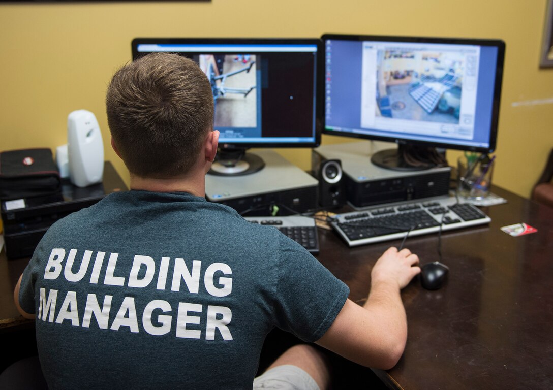 Cadet Col. Bradley Joyal, Air Force ROTC Detachment 172 cadet wing commander, scans surveillance cameras, Nov. 16, 2015, in Valdosta, Ga. Joyal graduated with a 3.89 grade point average while performing 15-hour work weeks as a student union building manager at a local college. (U.S. Air Force photo by Airman Greg Nash/Released)
