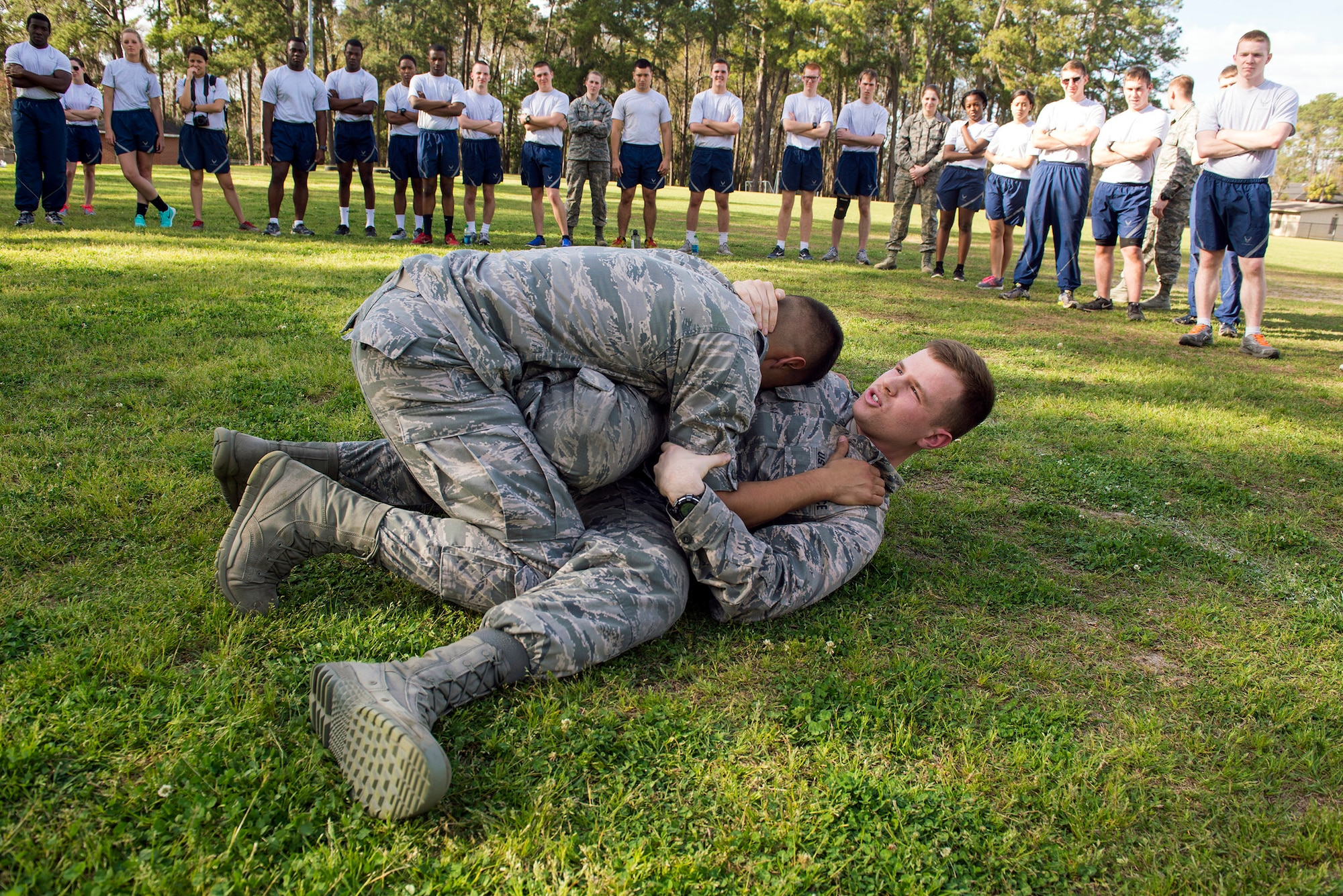 Cadet Col. Bradley Joyal, Air Force ROTC Detachment 172 cadet wing commander, bottom right, grapples with Cadet 2nd Lt. Jomar Aracena, during a combatives demonstration, March 10, 2016, in Valdosta, Ga. Joyal was a combatives cadet training assistant and a certified instructor, teaching more than 1,000 cadets in 2014. (U.S. Air Force photo by Airman 1st Class Greg Nash/Released)