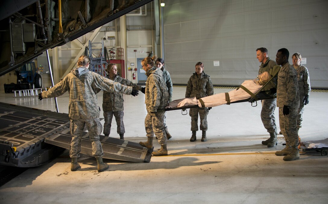 Members of the 914th Aeromedical Staging Squadron are trained on patient transport into a C-130 Aircraft during an exercise, May 2, 2016, Niagara Falls Air Reserve Station, N.Y.  The exercise simulates potential real world activities and allows members of the ASTS to complete annual hands-on training. (U. S. Air Force photo by Tech. Sgt. Stephanie Sawyer)