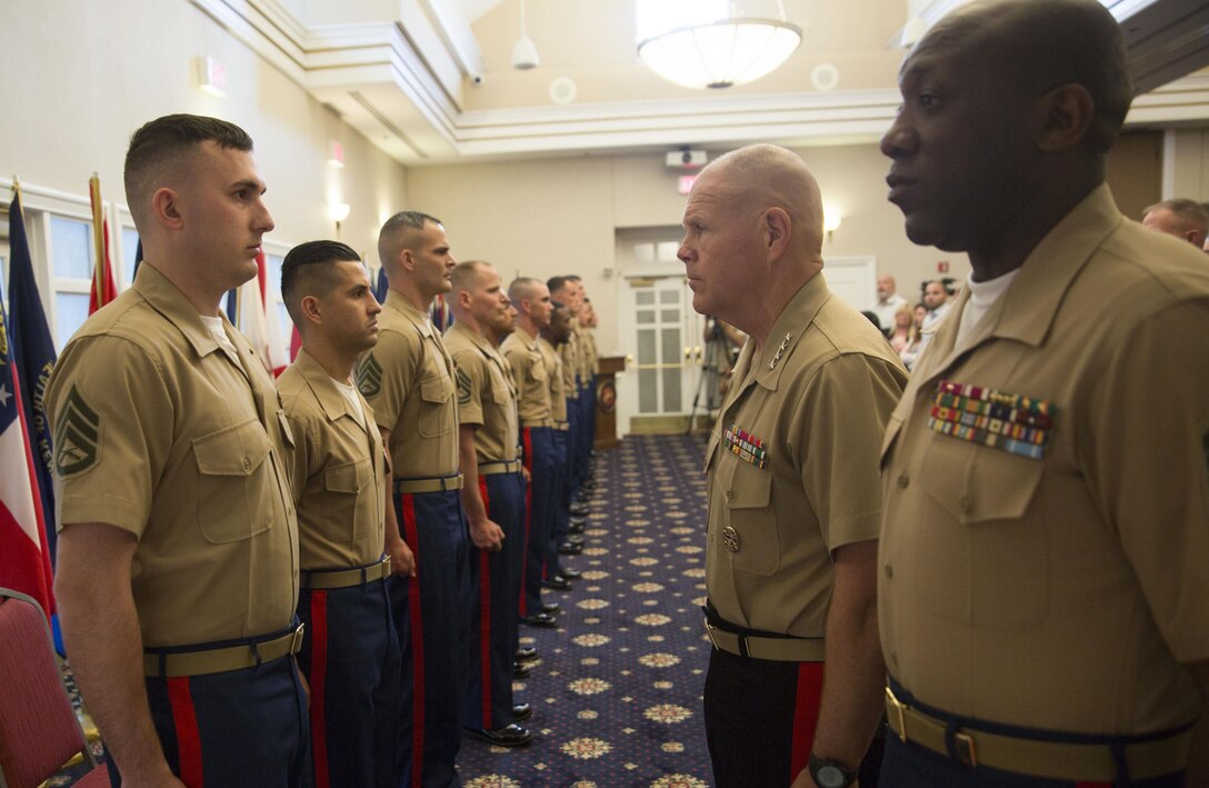 Recruiters and other Marines who made significant contributions to the Corps await to be awarded by Commandant of the Marine Corps Gen. Robert. B. Neller during the Commandant of the Marine Corps Combined Awards Ceremony aboard Marine Corps Base Quantico, Va., on May 11, 2016. Each Marine awarded demonstrated Marine Corps values in ethics, leadership and commitment. Neller awarded each Marine a Navy and Marine Corps Commendation Medal and thanked the families of the awardees for their sacrifices and their support. 