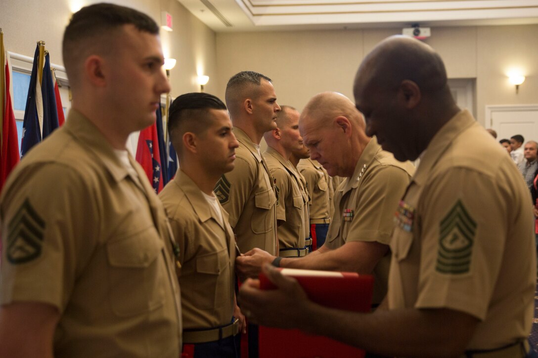 Commandant of the Marine Corps General Robert B. Neller awards Gunnery Sgt. Francisco Soto, the non-prior service recruiter of the year for 2015, with the Navy and Marine Corps Commendation Medal during the Commandant of the Marine Corps Combined Awards Ceremony aboard Marine Corps Base Quantico, Va., on May 11, 2016. Each Marine awarded demonstrated Marine Corps values in ethics, leadership and commitment. Neller thanked the families of the awardees for their sacrifices and their support. Soto is from Recruiting Station San Francisco, 12th Marine Corps District. 