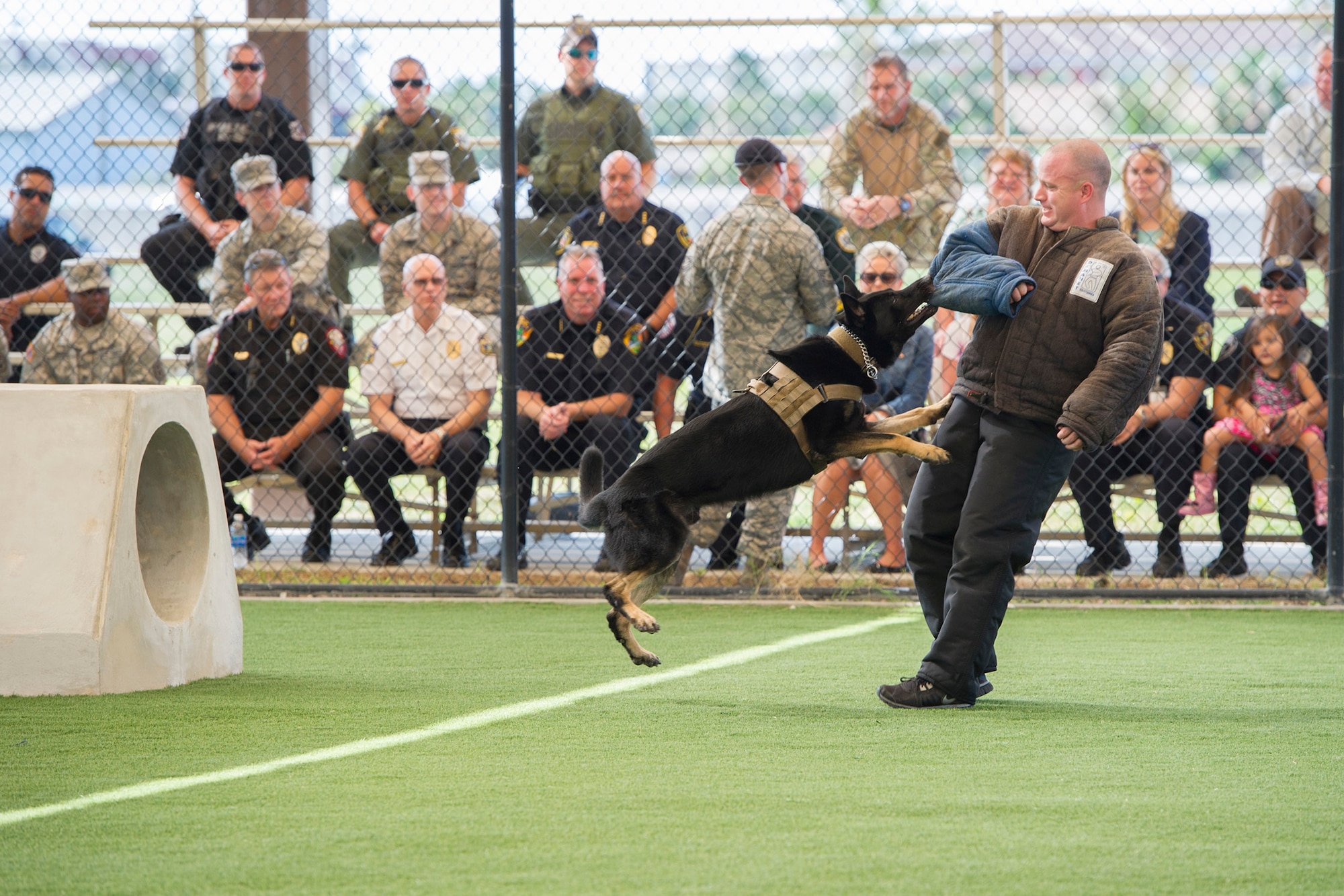 The 45th Security Forces Squadron held a ribbon cutting ceremony to unveil an upgraded military working dog obedience yard at Patrick Air Force Base, Fla., May 11, 2016.The ceremony included a military working dog demonstration and featured Chiefs of Police and local law enforcement K-9 officers from across Brevard County. Among the upgrades include a canopy which lowers the temperature 10 to 20 degrees and keeps the team training year-round all while reducing the impact of rain, sun and heat on our training operations. (U.S. Air Force photos/Matthew Jurgens/Released)