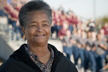 Chief Master Sergeant (ret.) Dale Armwood portrait near airmen participating in the Airmen's run at Lackland Air Force Base, Texas on Jan 8, 2009.  Chief Armwood, a Chester, PA native, began her career restocking medical evacuation aircraft that arrived at Clark Air Force Base, Philippines, during the Vietnam War.  Armwood's advice to new airmen who are women, "Don't use it as an excuse - Suck it up." Armwood served from April 1963 till October 1989. Twice in her career she was a Training Instructor at Lackland, was the first woman instructor at then SAC Academy, Barksdale Air Force Base, La. and first woman to develop curriculum for the Leadership and Management Development Center at Maxwell AFB, AL (U.S. Air Force photo/Lance Cheung)