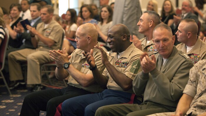 Gen. Robert Neller, commandant of the Marine Corps, Sgt. Maj. Ronald Green, sergeant major of the Marine Corps, Marines and guests applaud the finalists of the Commandant of the Marine Corps Combined Awards Ceremony at Marine Corps Base Quantico, Virginia, May 11, 2016. The ceremony recognized top performing Marine recruiters, drill instructors, combat instructors, career planners, security guards and athletes. 