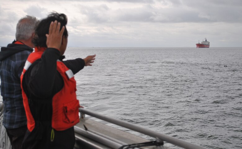 Joe Aguila and Steve Carr, crewmembers of the M/V John A. B. Dillard, Jr., keep an eye on the man overboard May 5. The Dillard crew conducted three days of rescue swimmer training in the San Francisco Bay May 3-5.