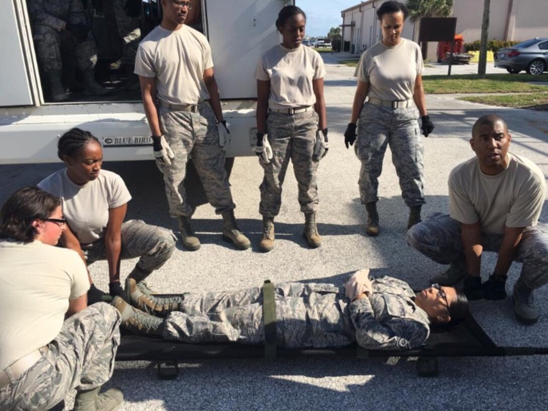 Cooperation in action: 932nd Medical Squadron and Aeromedical Staging Squadron Airmen work together on first aid skills and Humvee checks with their host training partner, the 920th Aeromedical Staging Squadron. Multiple long days are being spent in preparation for extensive medical training at MedBeach Exercise, near the 45th Space Wing at Patrick Air Force Base, Fla. (U.S. Air Force photos by Maj. Stan Paregien)