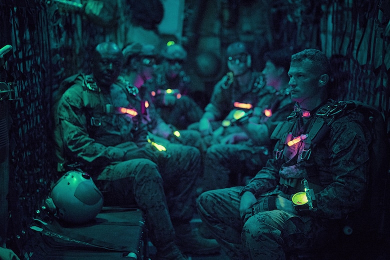 Marines with 3rd Reconnaissance Battalion, 3rd Marine Division, 3rd Marine Expeditionary Force, wait to jump from a C-130 Hercules over Yokota Air Base, May 11, 2016. The Marines were supported by the aircrew and aircraft assigned to the 36th Airlift Squadron. (U.S. Air Force photo by Senior Airman Delano Scott/Released)