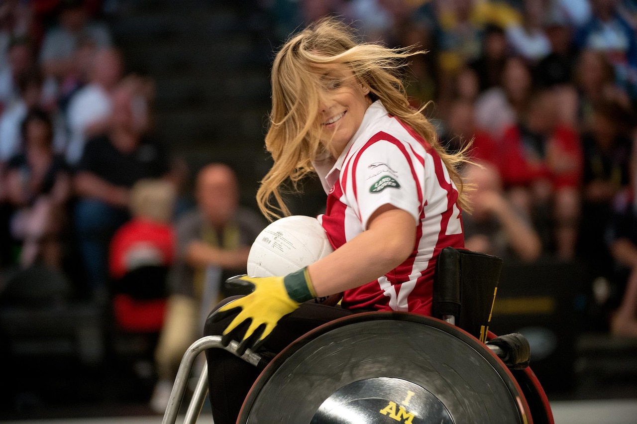Olympic gold medal gymnast Shawn Johnson plays wheelchair rugby during an exhibition match with adaptive athletes and celebrities in association with the 2016 Invictus Games in Orlando, Fla., May 11, 2016. DoD photo by EJ Hersom 