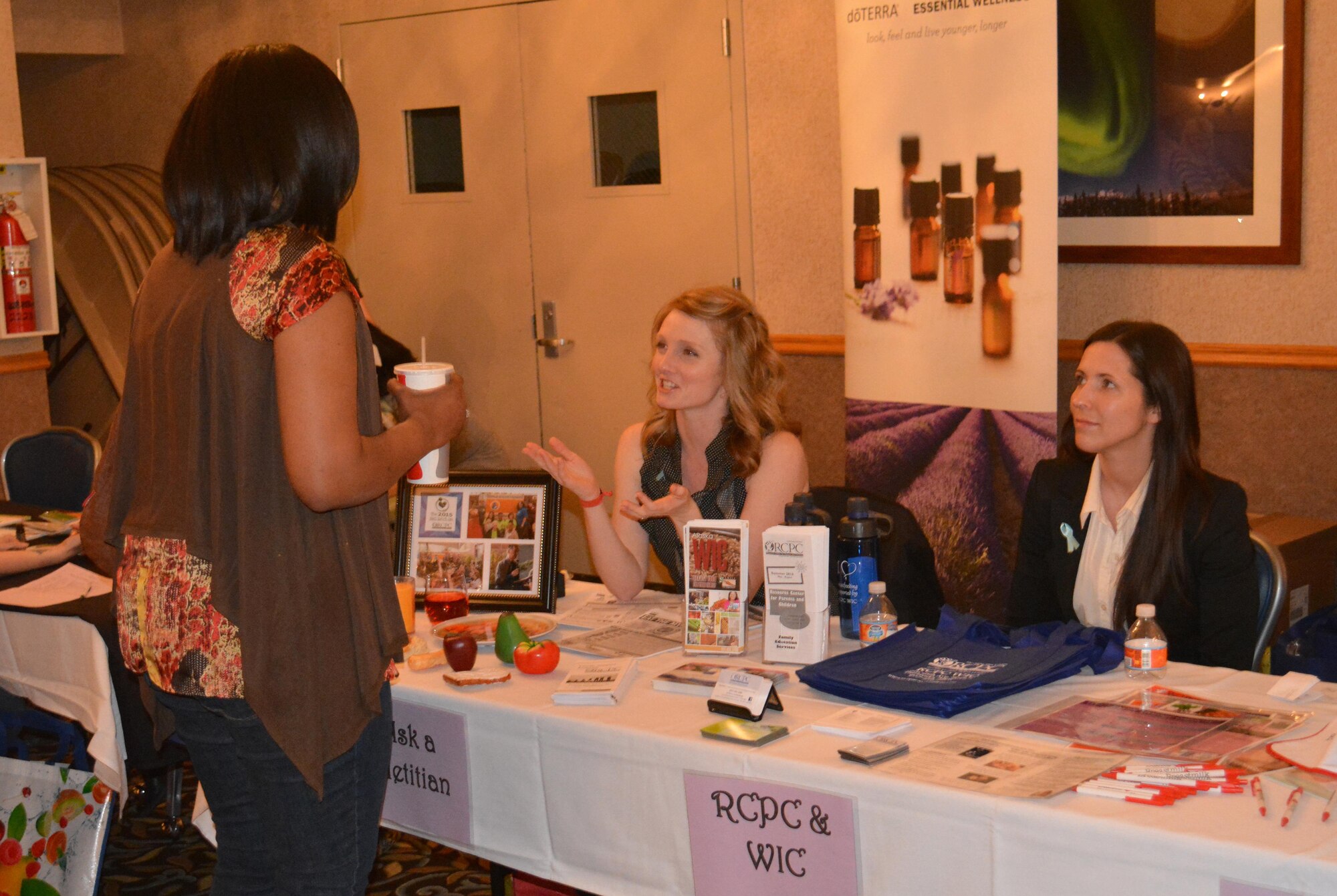 A dietician speaks to an attendee during Ladies Night Out, April 29, 2016, at Eielson Air Force Base, Alaska. Several professionals were available to answer questions the women had about their health. (U.S. Air Force photo by Capt. Abigail Rose/Released) 