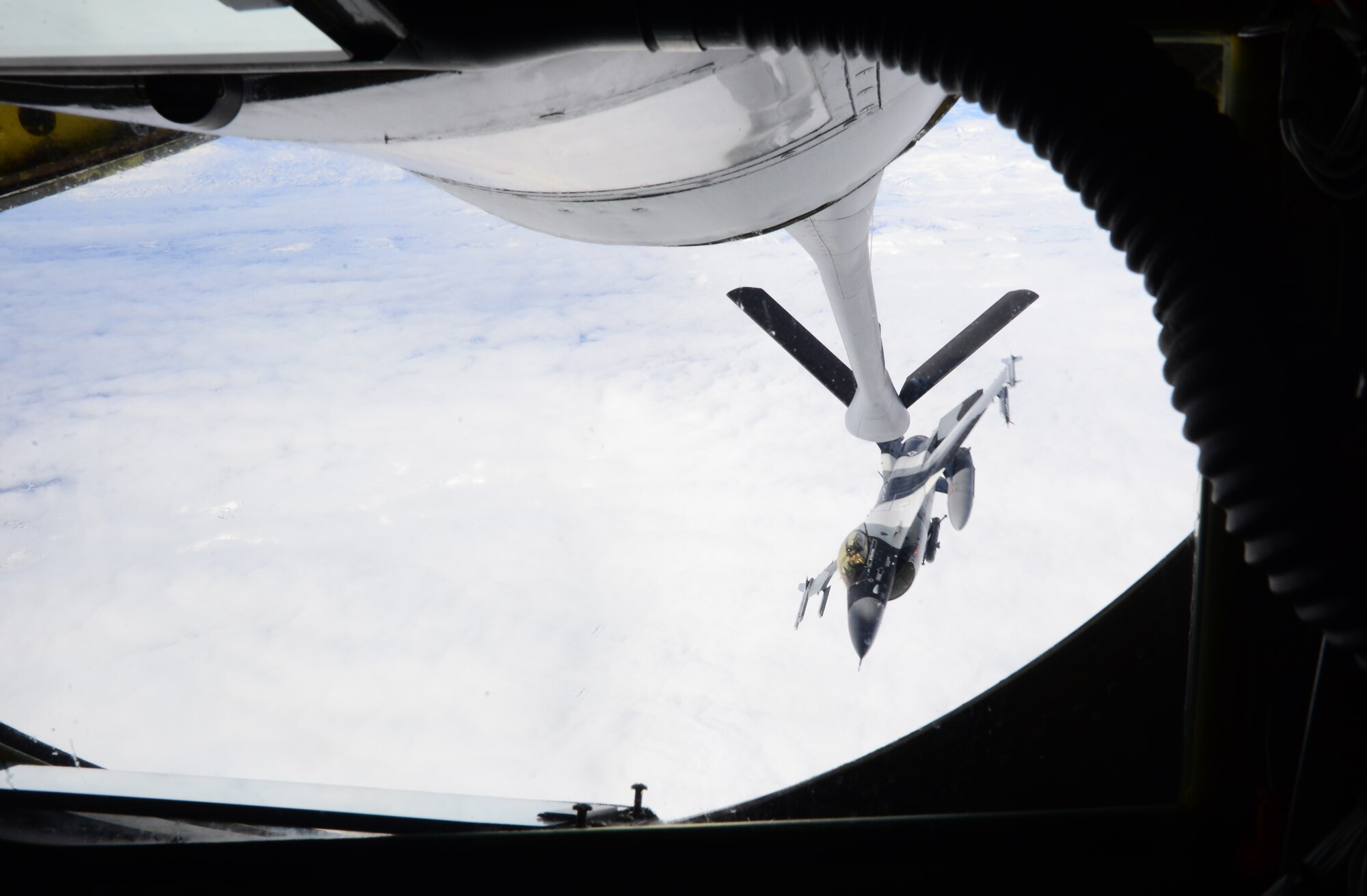 A U.S. Air Force F-16 Fighting Falcon with the 18th Aggressor Squadron at Eielson Air Force Base, Alaska, receives fuel May 10, 2016, during a RED FLAG-Alaska 16-1 exercise. The KC-135 Stratotanker, part of the Tanker Task Force, provides mid-air refueling to sustain fighter aircraft during a RED FLAG-Alaska exercise. (U.S. Air Force photo by Airman 1st Class Cassandra Whitman/Released)