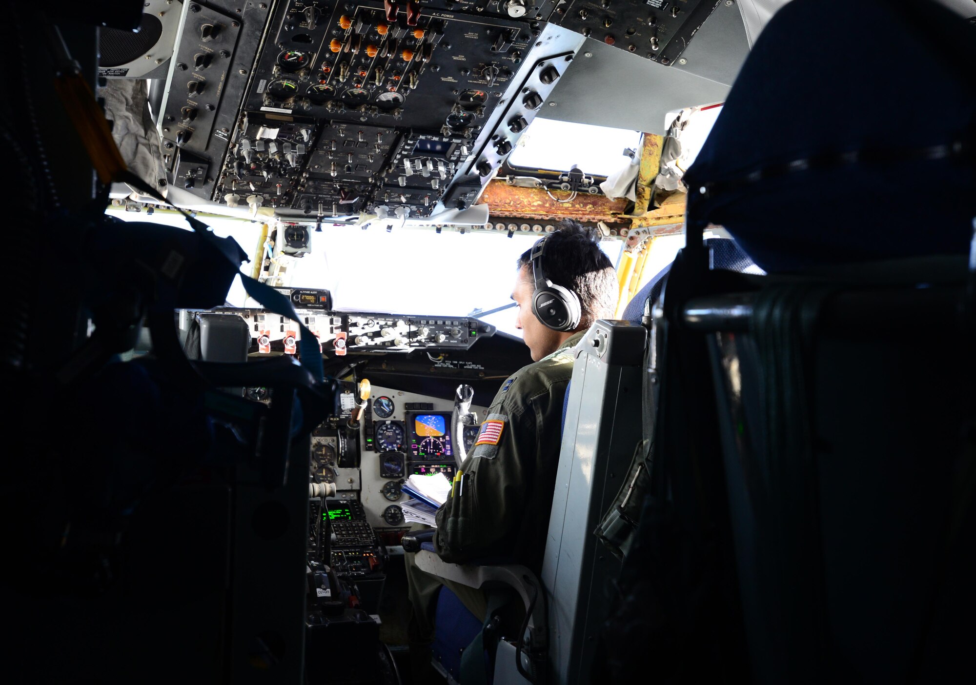 U.S. Air Force Capt. Karan Bansal, a 909th Air Refueling Squadron pilot assigned to Kadena Air Base, Japan, checks over controls May 10, 2016, during a RED FLAG-Alaska 16-1 exercise. The flight was part of an exercise training scenario that also provided an incentive flight for members of the Indian Air Force. (U.S. Air Force photo by Airman 1st Class Cassandra Whitman/Released)