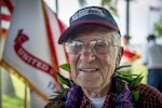 Charles Wolf, a World War ll veteran, smiles after a surprise ceremony held in his honor, at the Pearl Harbor Education Center, Hawaii, May 6, 2016. Wolf was presented a shadow box containing awards and medals by  Brig. Gen. Mark Spindler, Deputy Director of the Defense POW/MIA Accounting Agency (DPAA). After 72 years Wolf received the recognition he deserved for serving his country so many years ago. DPAA's mission is to provide the fullest possible accounting for our missing personnel to their families and the nation. (DoD photo by MC2 Aiyana Paschal/RELEASED)