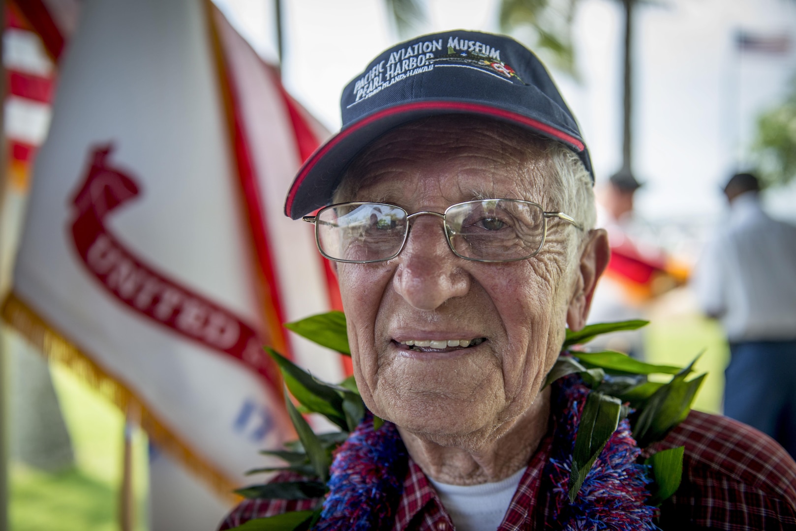 Charles Wolf, a World War ll veteran, smiles after a surprise ceremony held in his honor, at the Pearl Harbor Education Center, Hawaii, May 6, 2016. Wolf was presented a shadow box containing awards and medals by  Brig. Gen. Mark Spindler, Deputy Director of the Defense POW/MIA Accounting Agency (DPAA). After 72 years Wolf received the recognition he deserved for serving his country so many years ago. DPAA's mission is to provide the fullest possible accounting for our missing personnel to their families and the nation. (DoD photo by MC2 Aiyana Paschal/RELEASED)