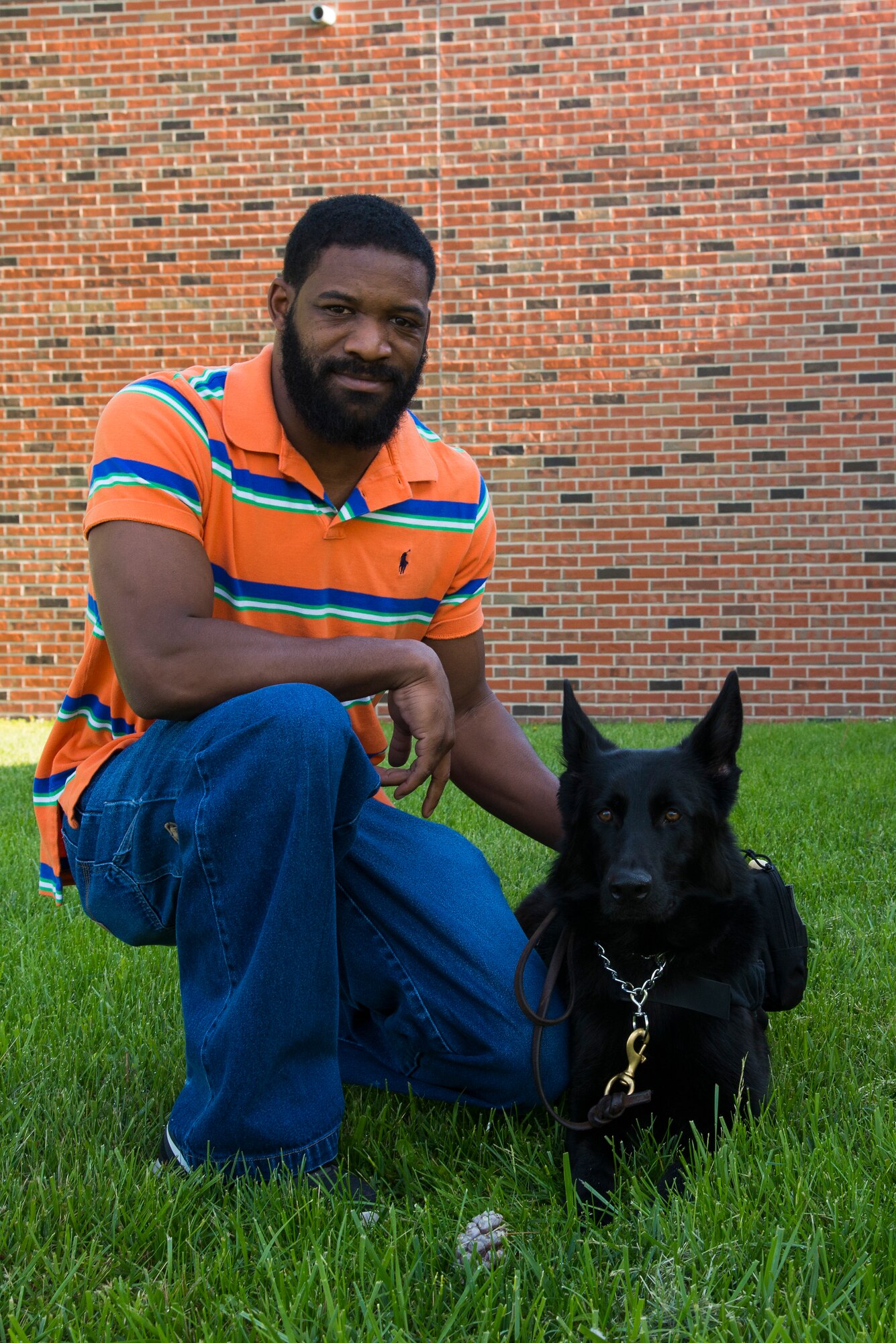Former Scott Air Force Base Airman Travis Johnson with his service dog, Bella. Johnson recently spoke at the First Term Airmen Center to encourage young Airmen to speak openly about their struggles with stress management. (U.S. Air Force photo/Senior Airman Jake Eckhardt)