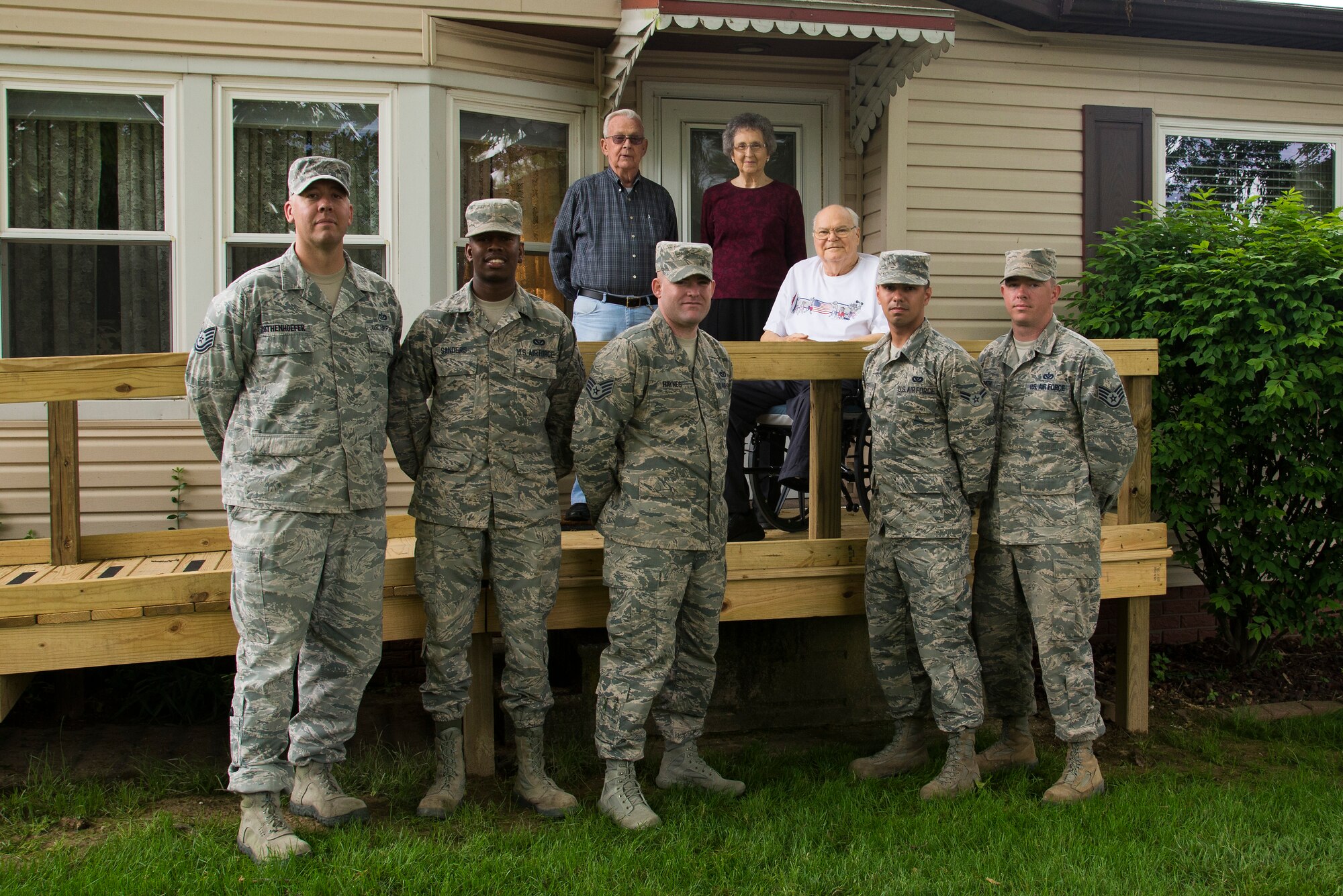 Several members of the 375th Civil Engineering Squadron recently volunteered for days of their off-duty time to build a wheelchair ramp for Belleville couple Robert and Carol Ripley. Pictured (front row, left to right) are Tech. Sgt. Daniel Rothenhoefer, Airman 1st Class Andre Saunders, Staff Sgt. Marc Heynes, Airman 1st Class Rodney Bilyeu and Staff Sgt. Michael Smith; (back row, left to right) Denver Williams, Carol Ripley and Robert Ripley. (courtesy photo)