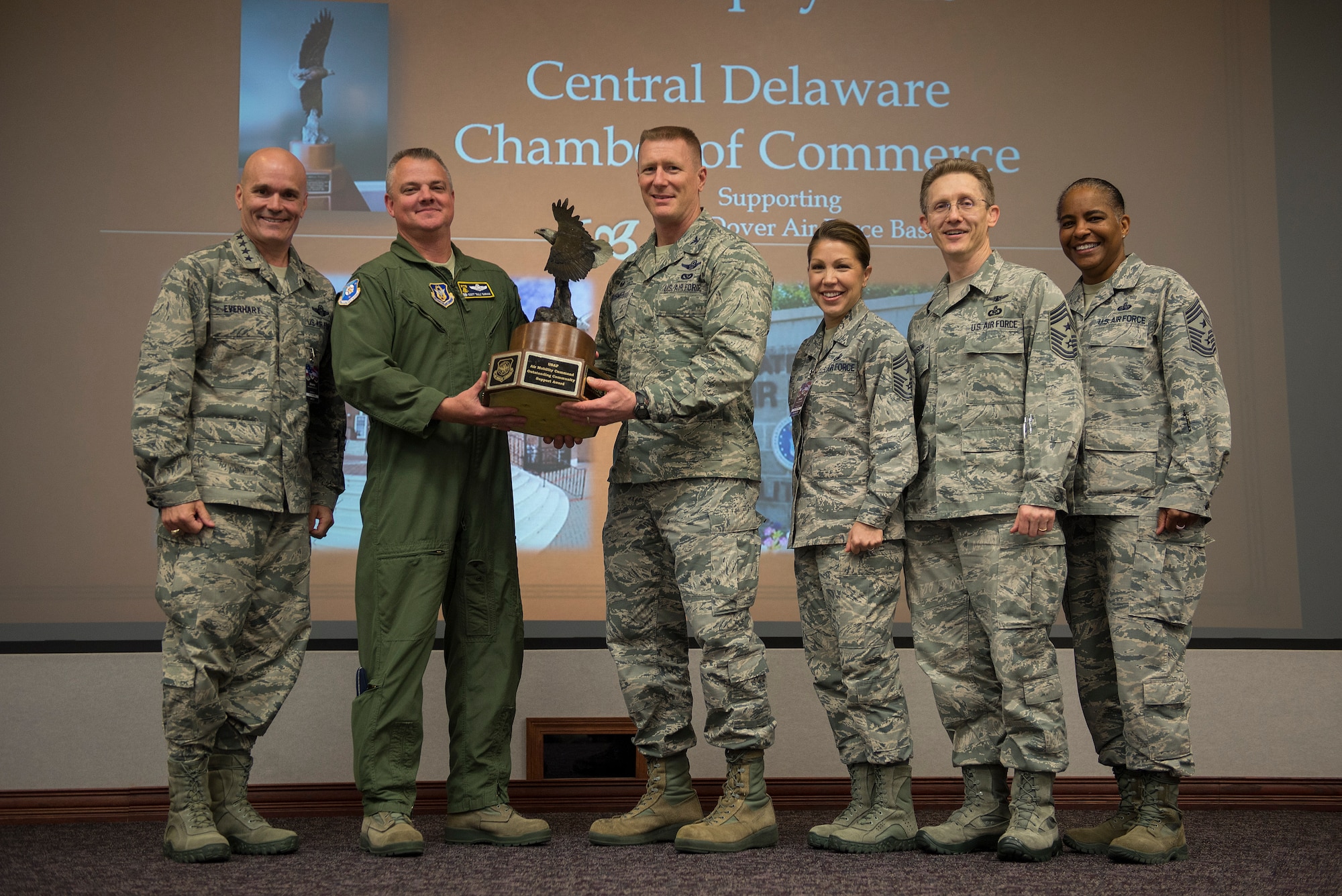 General Carlton Everhart II, Air Mobility Command commander, and Chief Master Sgt. Shelina Frey, Air Mobility Command command chief, presented the AMC Community Support Award, also known as the Abilene Trophy, to Dover Air Force Base senior leaders at Scott AFB May 12, 2016. The award was established on Jan. 1, 1999 by the Military Affairs Committee of Abilene, Texas, and the United States Air Force Air Mobility Command. (U.S. Air Force photo/Senior Airman Jacob Eckhardt)



