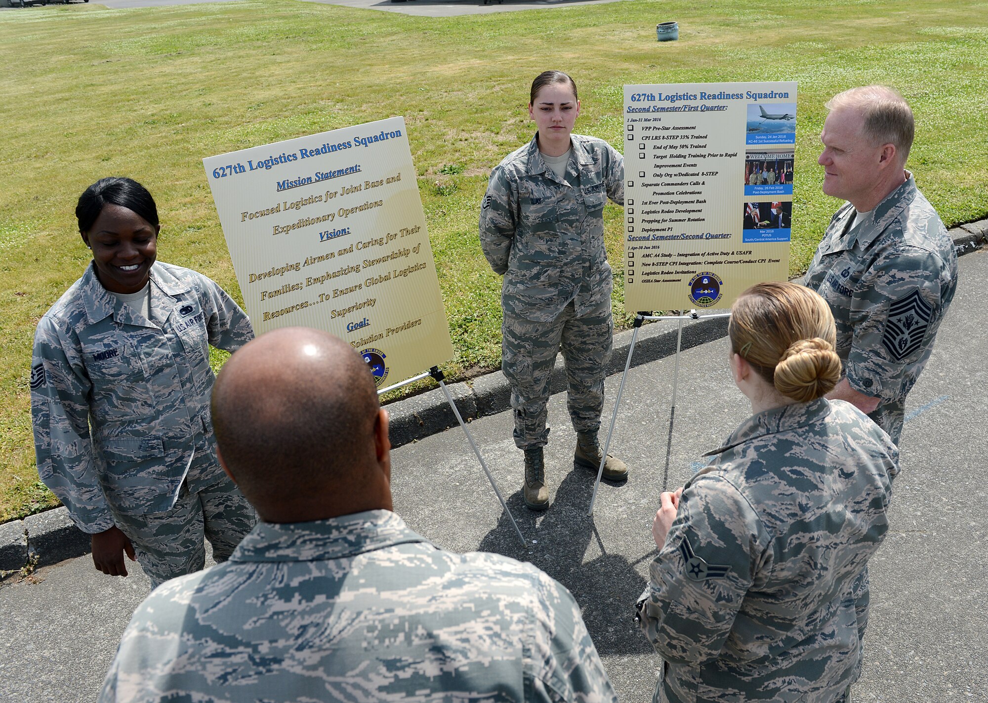Tech Sgt. Brandy Moore (left), 627th Logistics Readiness Squadron aircraft part store noncommissioned officer in-charge, and Staff Sgt. Shona Clay (right), 627th LRS vehicle operator, brief Chief Master Sgt. of the Air Force James Cody May 3, 2016 at Joint Base Lewis-McChord, Wash. Cody had the opportunity to engage with service members and discuss joint base operations on an Army led joint base. (U.S. Air Force photo/Senior Airman Divine Cox)