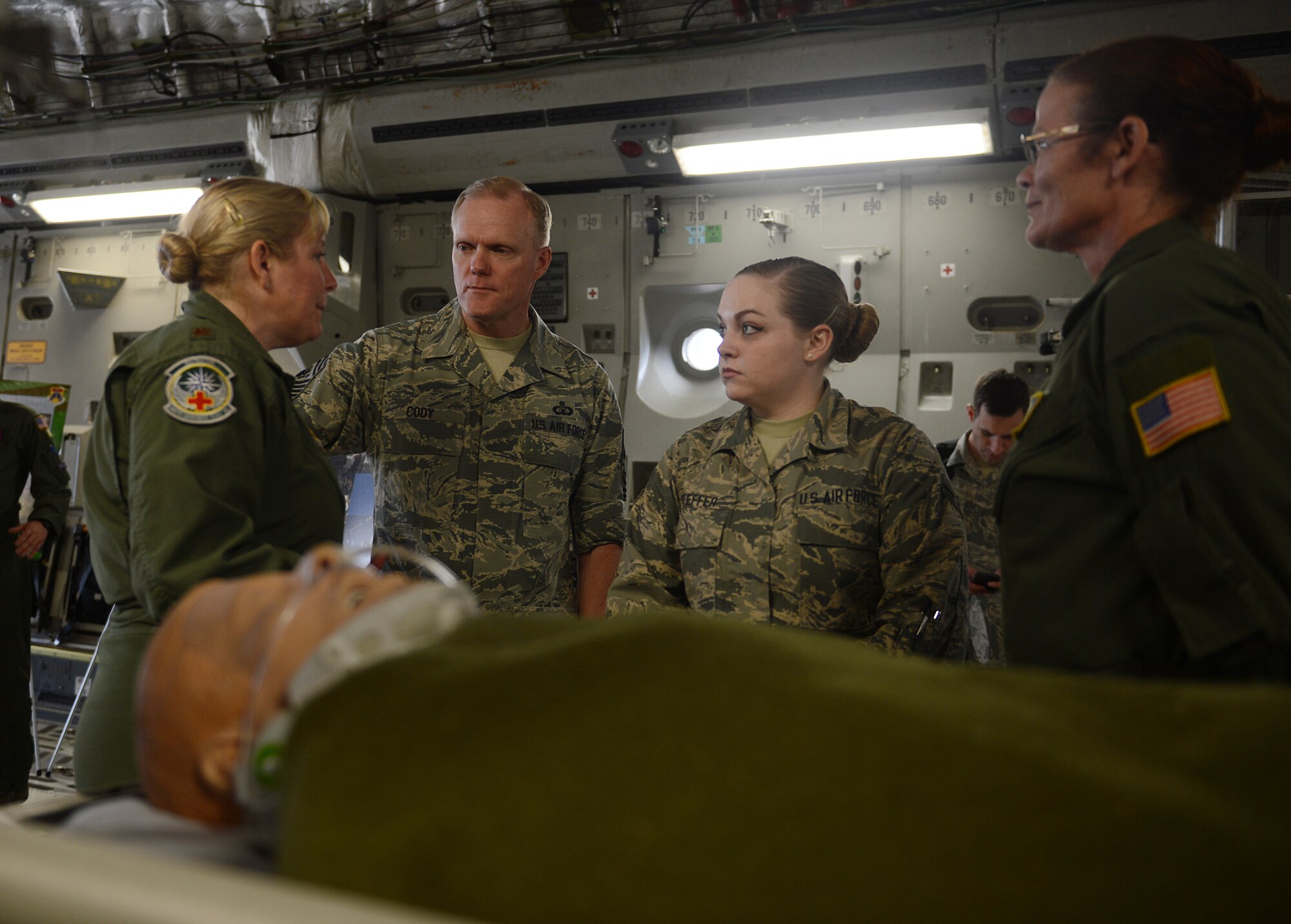 Maj. Beverly Davidson (left), 446th Airlift Wing Aeromedical Evacuation Squadron flight nurse, briefs Chief Master Sgt. of the Air Force James Cody, May 3, 2016 at, Joint Base Lewis-McChord, Wash. Davidson briefed Cody on the 446th AES mission and how it fulfills their global mobility commitments. (U.S. Air Force photo/Senior Airman Divine Cox)