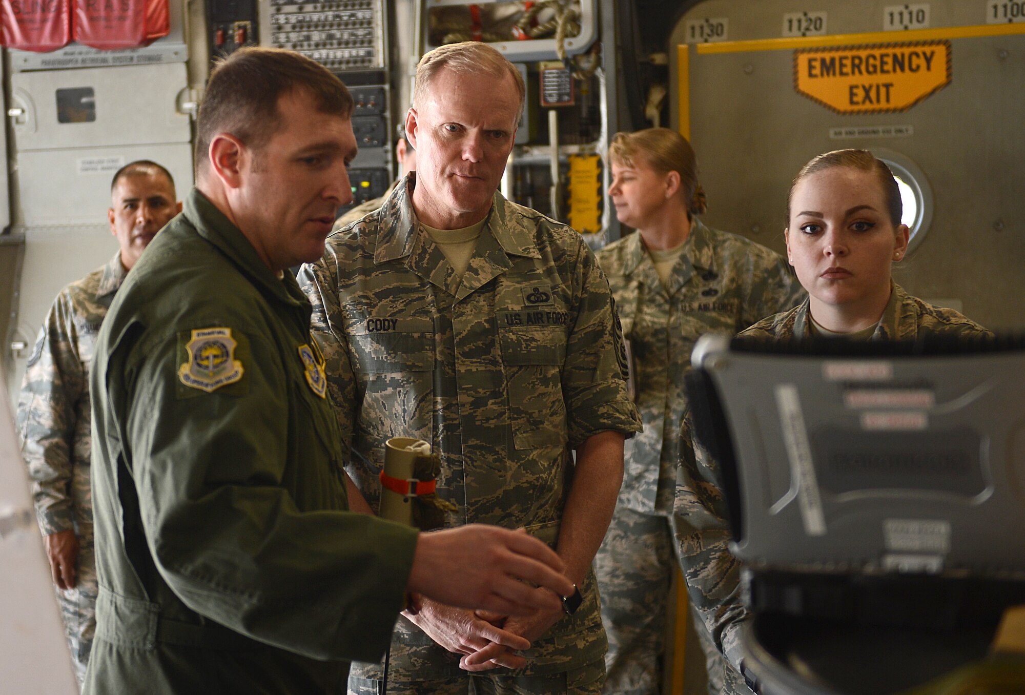 Tech Sgt. Jared Beadle, 62nd Operations Group loadmaster, briefs Chief Master Sgt. of the Air Force James Cody, May 3, 2016 at Joint Base Lewis-McChord, Wash. Beadle briefed Cody on the ins-and-outs of the Joint Precision Airdrop System and how it plays an intricate role in helping Team McChord provide rapid global mobility. (U.S. Air Force photo/Senior Airman Divine Cox)