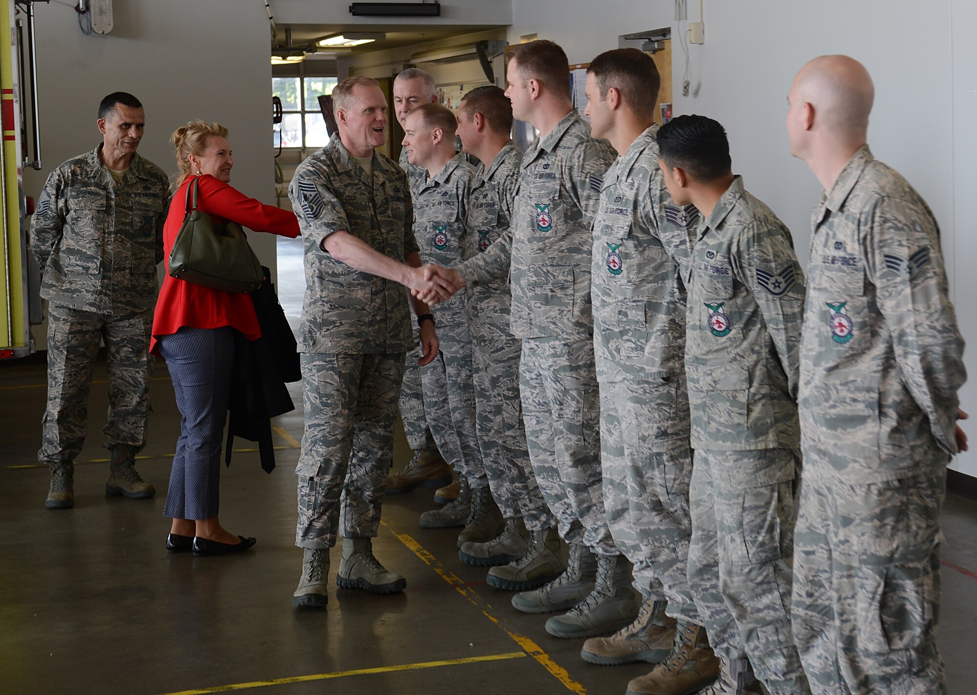 Chief Master Sgt. of the Air Force James Cody and his wife, retired Chief Master Sgt. Athena Cody greet fire fighters from the 627th Civil Engineer Squadron May 3, 2016 at Joint Base Lewis-McChord, Wash. The Codys spent two days on JBLM meeting with service members and learning about the JBLM missions. (U.S. Air Force photo/Senior Airman Divine Cox)