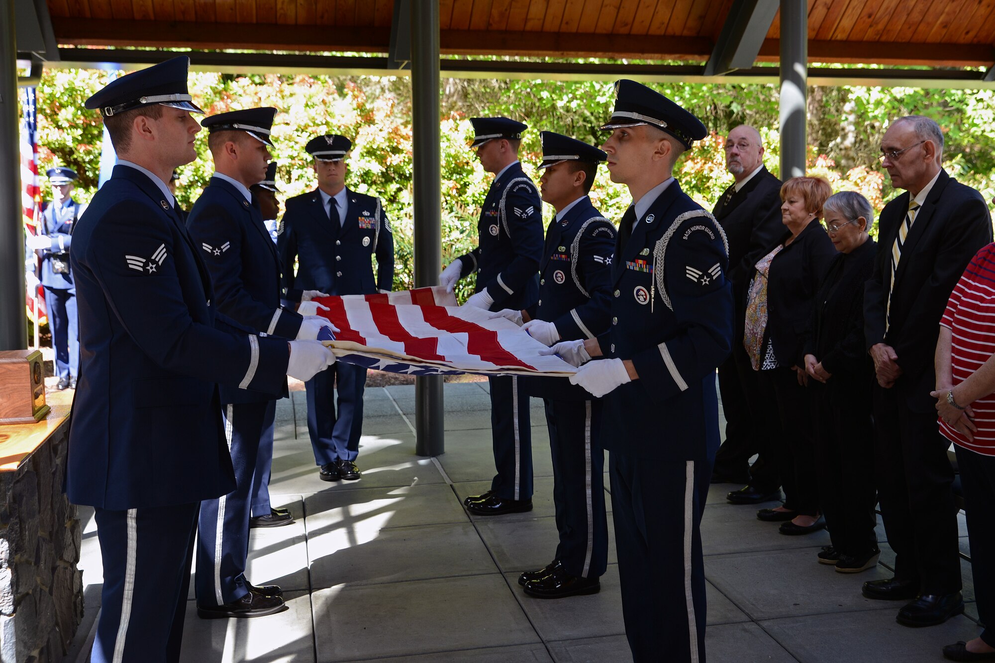 Ceremonial guardsmen from the McChord Field Honor Guard perform a flag folding ceremony for Airman Second Class Sprague May 10, 2016, at Tahoma National Cemetery in Kent, Wash. Sprague received full military honors that included a flag folding ceremony, a firing party, the presenting of the colors and the playing of Taps. (U.S. Air Force photo/Senior Airman Jacob Jimenez) 