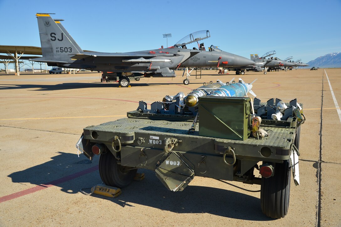 Munitions sit on the aircraft ramp at Hill Air Force Base, Utah, May 3, 2016, waiting to be loaded onto F-15 Strike Eagle aircraft from Seymour Johnson AFB, N.C.  The F-15s, along with other fighter and bomber aircraft, participated in the U.S. Air Force air-to-ground weapons evaluation known as Combat Hammer. Combat Hammer, which runs until May 14, tests and validates the performance of crews, pilots and their technology while deploying precision-guided munitions.  (U.S. Air Force photo by R. Nial Bradshaw)