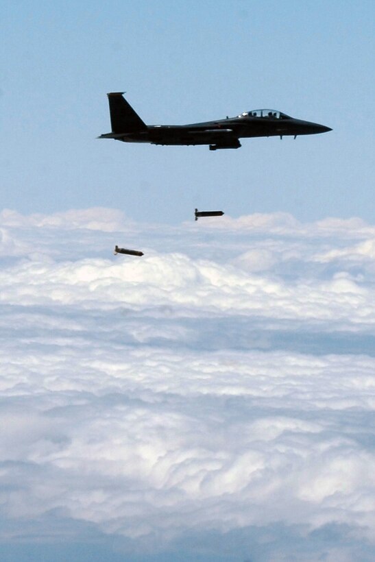 An F-15 Strike Eagle aircraft from Seymour Johnson Air Force Base, N.C., drops munitions over the Utah Test and Training Range, May 2, 2016. The 86th Fighter Weapons Squadron, a Hill tenant unit, is conducting the U.S. Air Force air-to-ground weapons evaluation known as Combat Hammer to test and validate the performance of crews, pilots and their technology while deploying precision-guided munitions. With support from the 388th Fighter Wing and 75th Air Base Wing, 86th FWS Airmen are collecting and analyzing data on how these precision guided munitions perform along with their suitability for use in combat. (U.S. Air Force photo by 86th Fighter Weapons Squadron)
