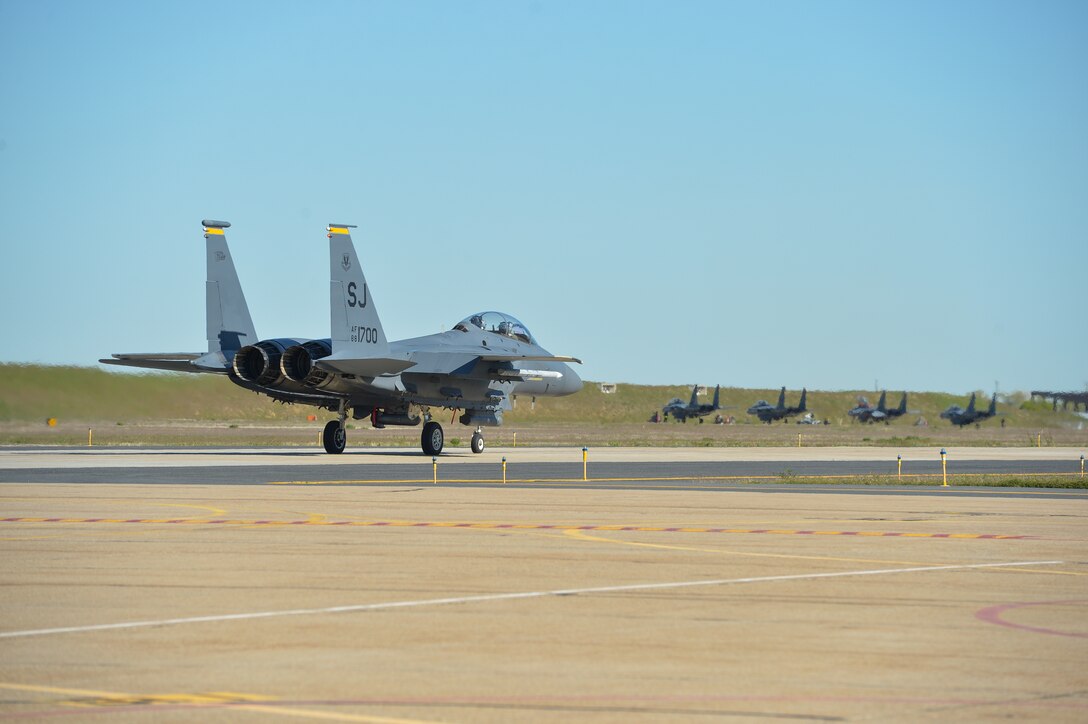 F-15 Strike Eagle aircraft from Seymour Johnson Air Force Base, N.C., taxi before flight May 3 at Hill AFB, Utah. The F-15s, along with other fighter and bomber aircraft, participated in the U.S. Air Force air-to-ground weapons evaluation known as Combat Hammer. Combat Hammer, which runs until May 14, tests and validates the performance of crews, pilots and their technology while deploying precision-guided munitions.  (U.S. Air Force photo by R. Nial Bradshaw)
