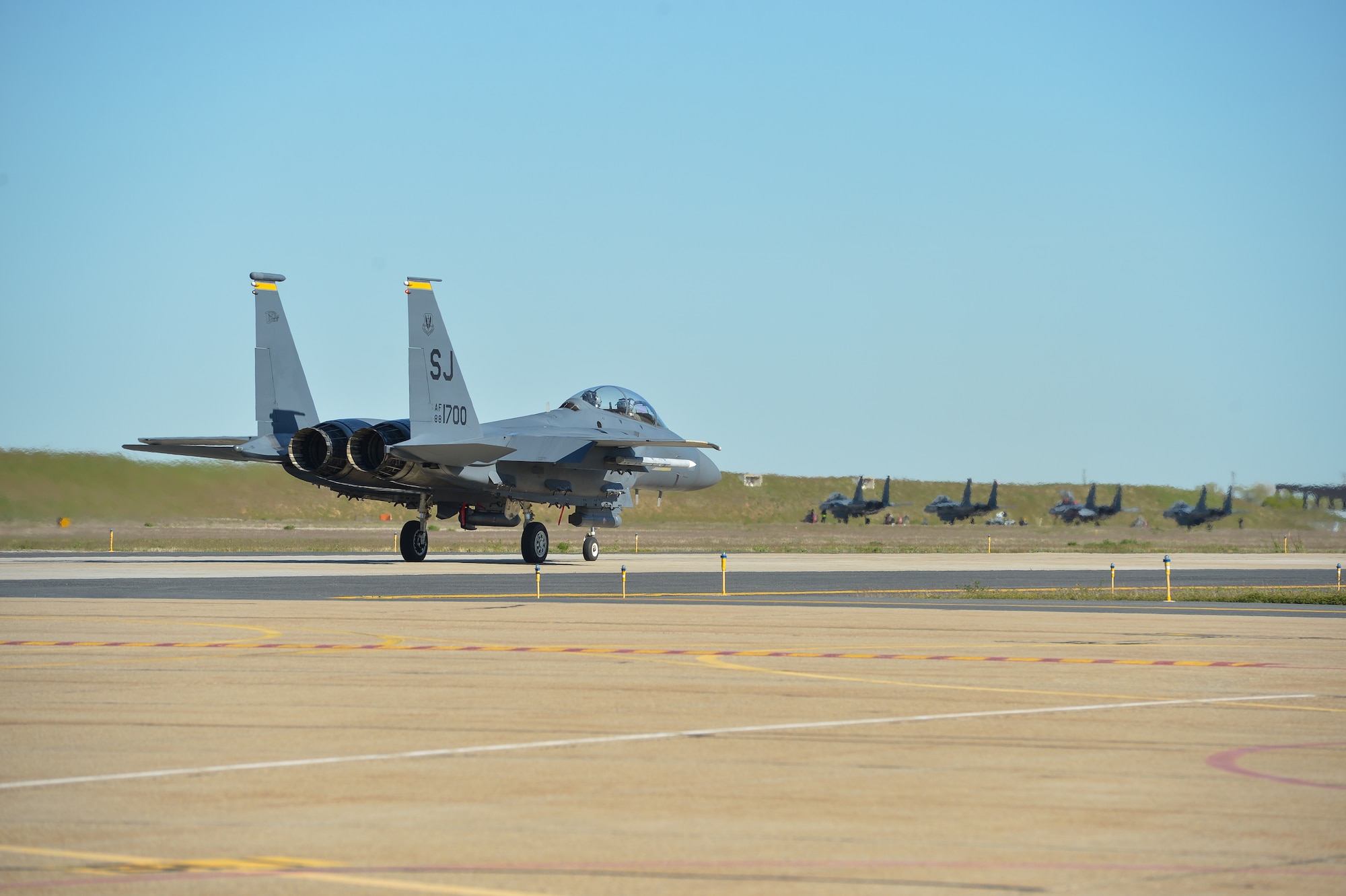 F-15 Strike Eagle aircraft from Seymour Johnson Air Force Base, N.C., taxi before flight May 3 at Hill AFB, Utah. The F-15s, along with other fighter and bomber aircraft, participated in the U.S. Air Force air-to-ground weapons evaluation known as Combat Hammer. Combat Hammer, which runs until May 14, tests and validates the performance of crews, pilots and their technology while deploying precision-guided munitions.  (U.S. Air Force photo by R. Nial Bradshaw)