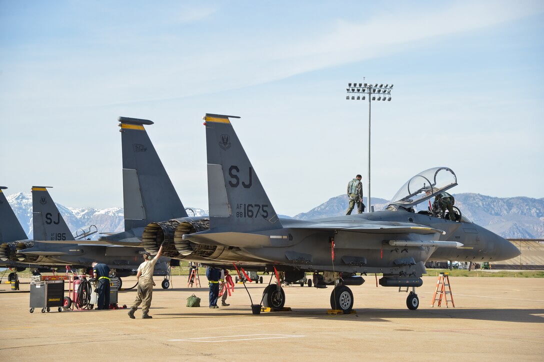 Airmen from the 4th Fighter Wing, Seymour Johnson Air Force Base, N.C., ready an F-15 Strike Eagle aircraft for flight May 4 at Hill AFB, Utah.  The F-15s, along with other fighter and bomber aircraft, participated in the U.S. Air Force air-to-ground weapons evaluation known as Combat Hammer. Combat Hammer, which runs until May 14, tests and validates the performance of crews, pilots and their technology while deploying precision-guided munitions.  (U.S. Air Force photo by R. Nial Bradshaw)