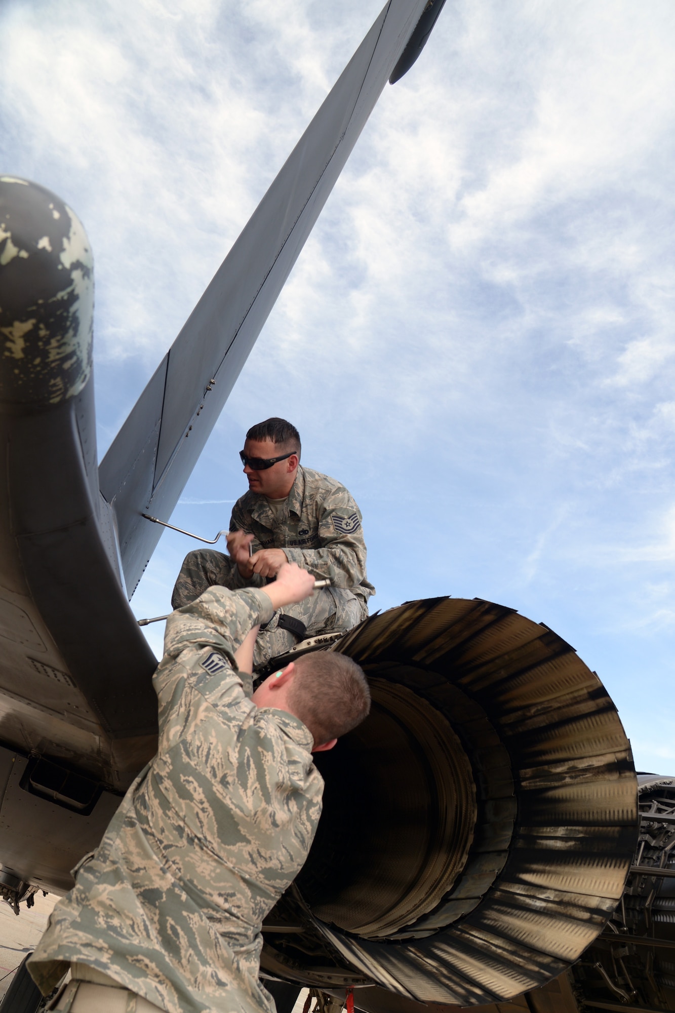 Tech. Sgt. Ben Mahan, above, and Staff Sgt. Bradley Duncan, 336th Aircraft Maintenance Unit avionics technicians from Seymour Johnson Air Force Base, N.C., perform maintenance on an F-15 Strike Eagle aircraft May 4 at Hill AFB, Utah. More than 40 combat aircraft participated in the U.S. Air Force air-to-ground weapons evaluation known as Combat Hammer including: F-15Es from Seymour Johnson AFB, N.C.; A-10s from Davis-Monthan AFB, N.M.; F-16s from Hill AFB and Tuscon Air National Guard Base, Arizona; B-1s from Dyess AFB, Texas; and B-52s from Minot AFB, N.D. The fighter units deployed to Hill, while bomber units participated from their home stations. (U.S. Air Force photo by Paul Holcomb)