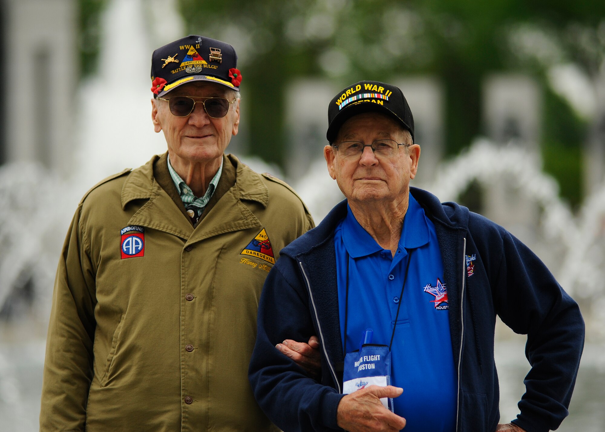 Harold Bradley and Harry Miller, both World War II Army veterans, reunite during an honor flight trip at the National World War II Memorial in Washington D.C., April 30, 2016. Bradley and Miller served in the same unit for the Army at the Battle of the Bulge and were able to reunite when Bradley was selected to participate with Honor Flight Houston. (U.S. Air Force photo/Tech. Sgt. Bryan Franks)