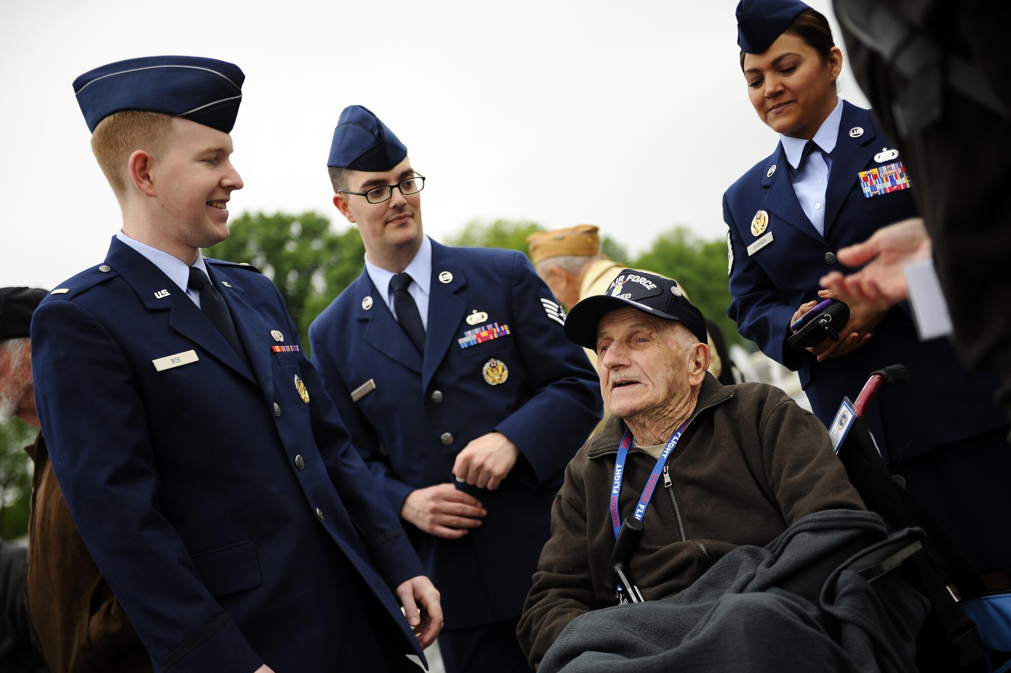 Airmen visit with a World War II veteran from the Georgia Honor Flight at the National World War II Memorial in Washington, D.C., April 30, 2016. The Georgia Honor Flight was one of many such flights to visit the nation’s capital. Upon their arrival, flight members were greeted by military personnel, Honor Flight volunteers and well-wishers (U.S. Air Force photo/Tech. Sgt. Bryan Franks)