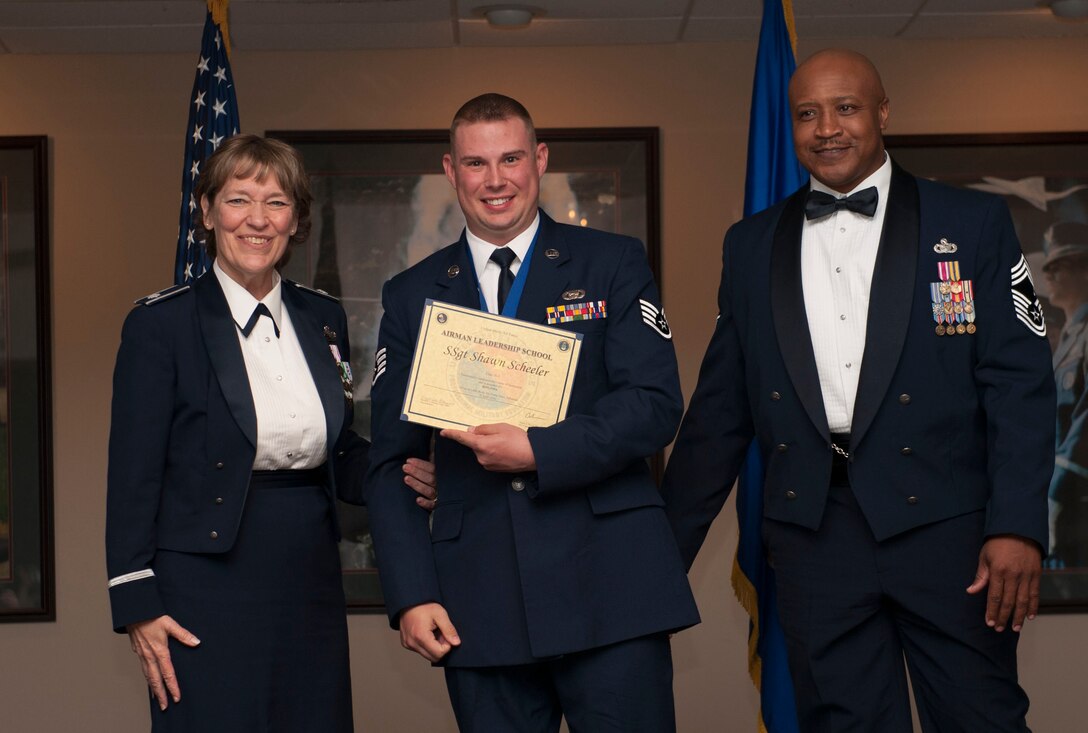 Senior Airman Shawn Scheeler receives his certificate for completing Airman Leadership School April 7, 2016 at Little Rock Air Force Base, Little Rock Ark. (Senior Airman Kaylee Clark/Released)