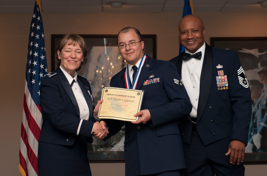 Senior Airman Stephen Garrett receives his certificate for completing Airman Leadership School April 7, 2016 at Little Rock Air Force Base, Little Rock Ark. (Senior Airman Kaylee Clark/Released)